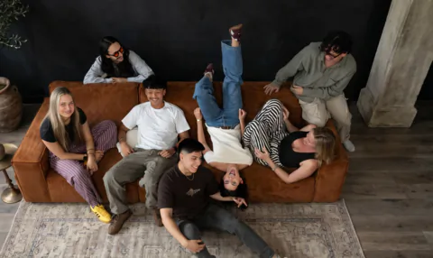 Beinc team sharing a candid moment on the studio couch