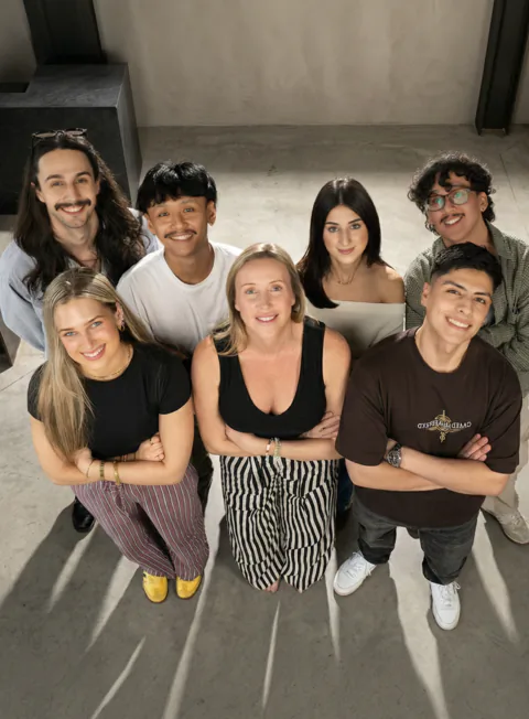 Beinc creative agency team looking upward in the studio